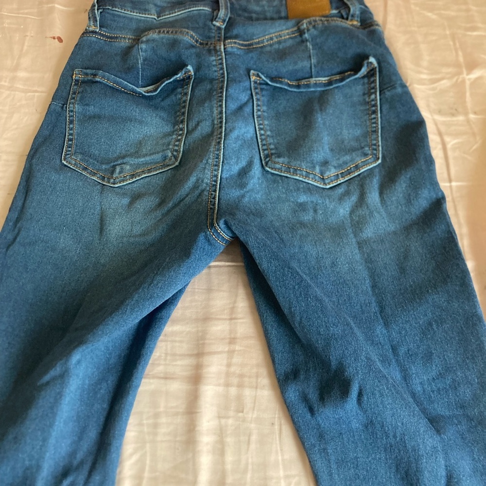 Blue Dollhouse skinny jeans.